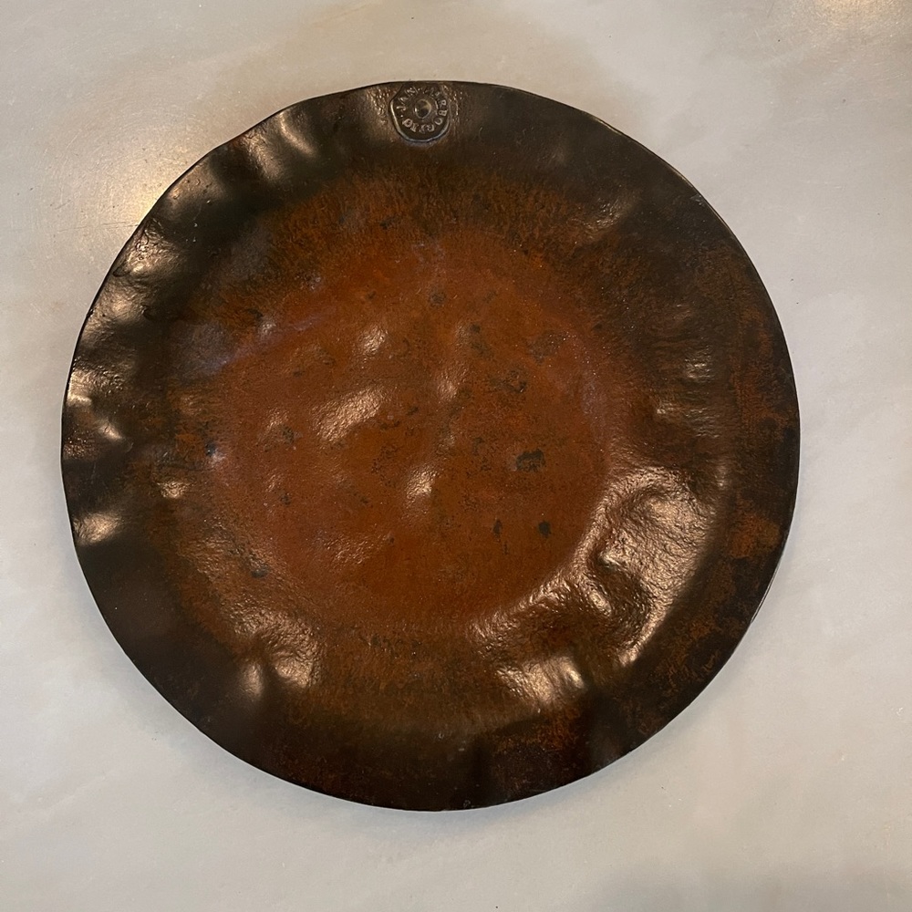 Jan Barboglio hand hammered metal plate or trinket dish.  It measures 7” across